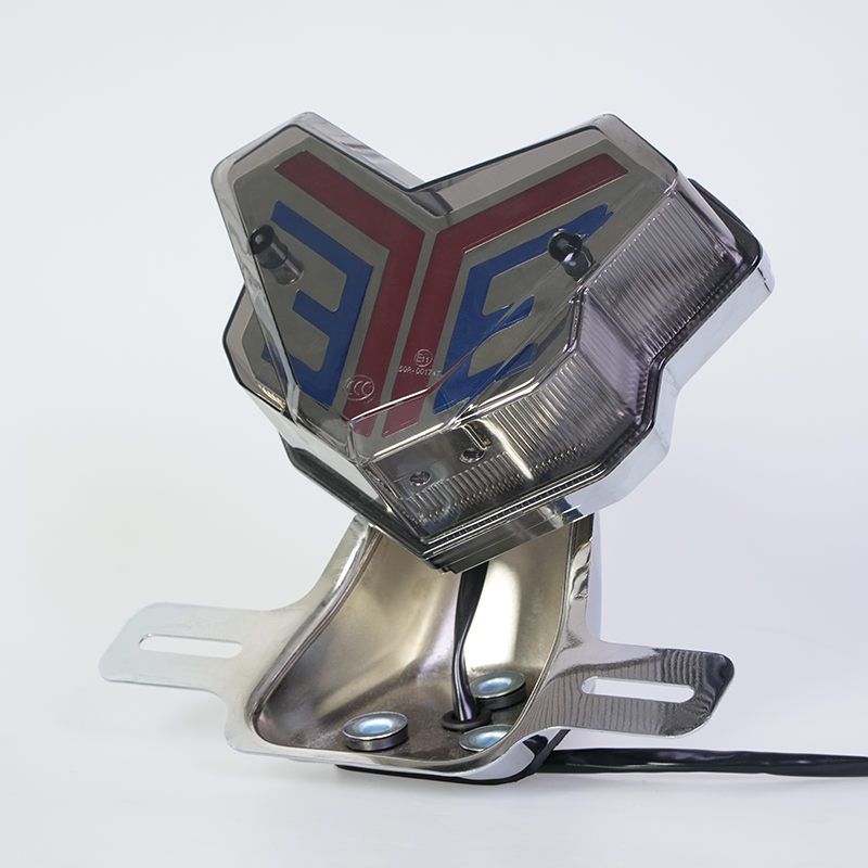 Angled view V-shape motorcycle LED tail light, smoke cover, chrome mounting holder