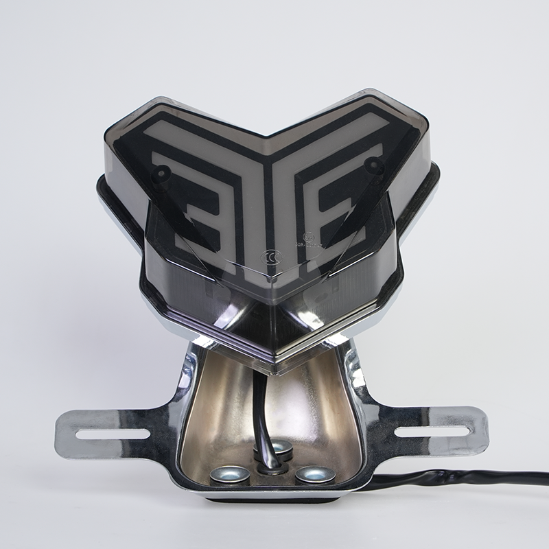 V geometric motorbike rear tail lamp, smoke lens, chrome mounting holder front view