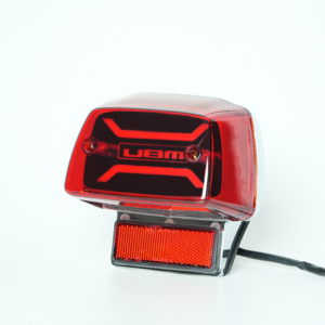GN125 motorcycle LED tail light side view, customizable logo pattern on black panel, red lens rear brake lamp