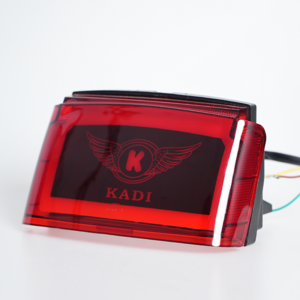 Side‑angle shot of red lens motorcycle tail lamp, customizable logo surface, static off state