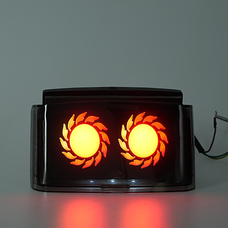 Red glowing motorcycle rear LED brake lamp, two reserved positions for personalized custom logos